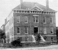Black and White photo of a large brick house